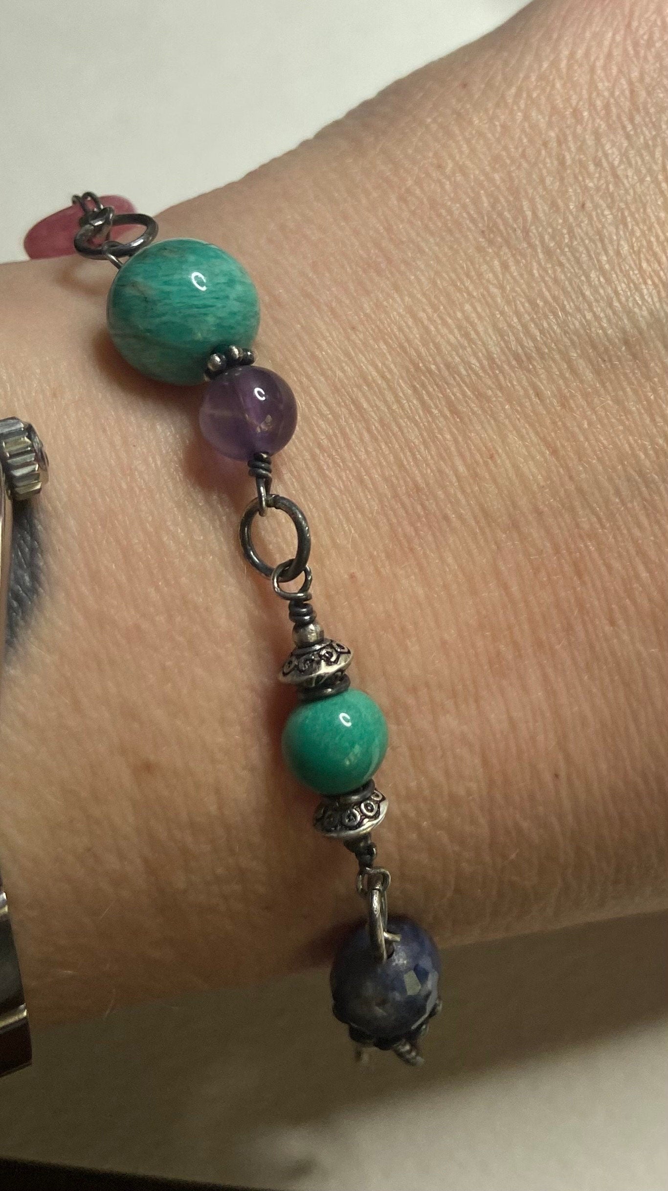 Sterling silver bracelet with star sapphire, amazonite, amethyst, and rhodochrosite beads.