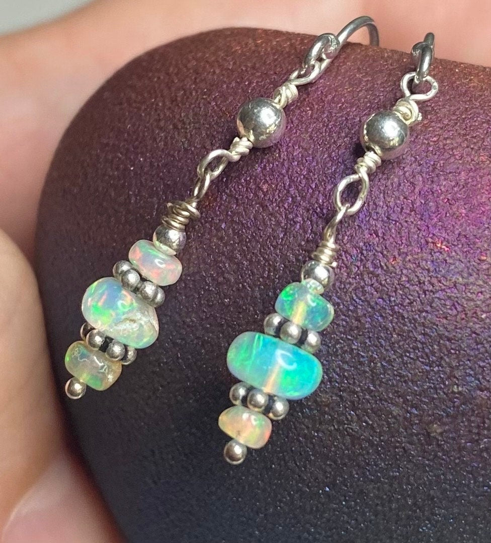 Ethiopian Wello Opal sterling silver dangle drop earrings with organic shapes and play of color.