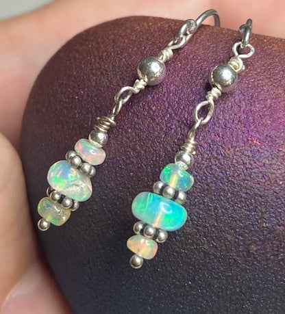 Ethiopian Wello Opal sterling silver dangle drop earrings with organic shapes and play of color.
