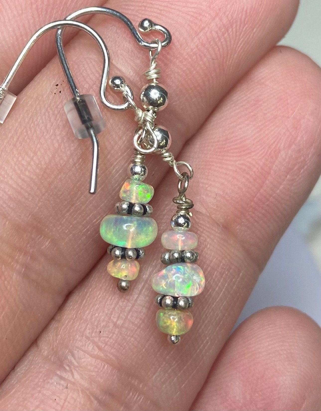 Ethiopian Wello Opal sterling silver dangle drop earrings with organic shapes.