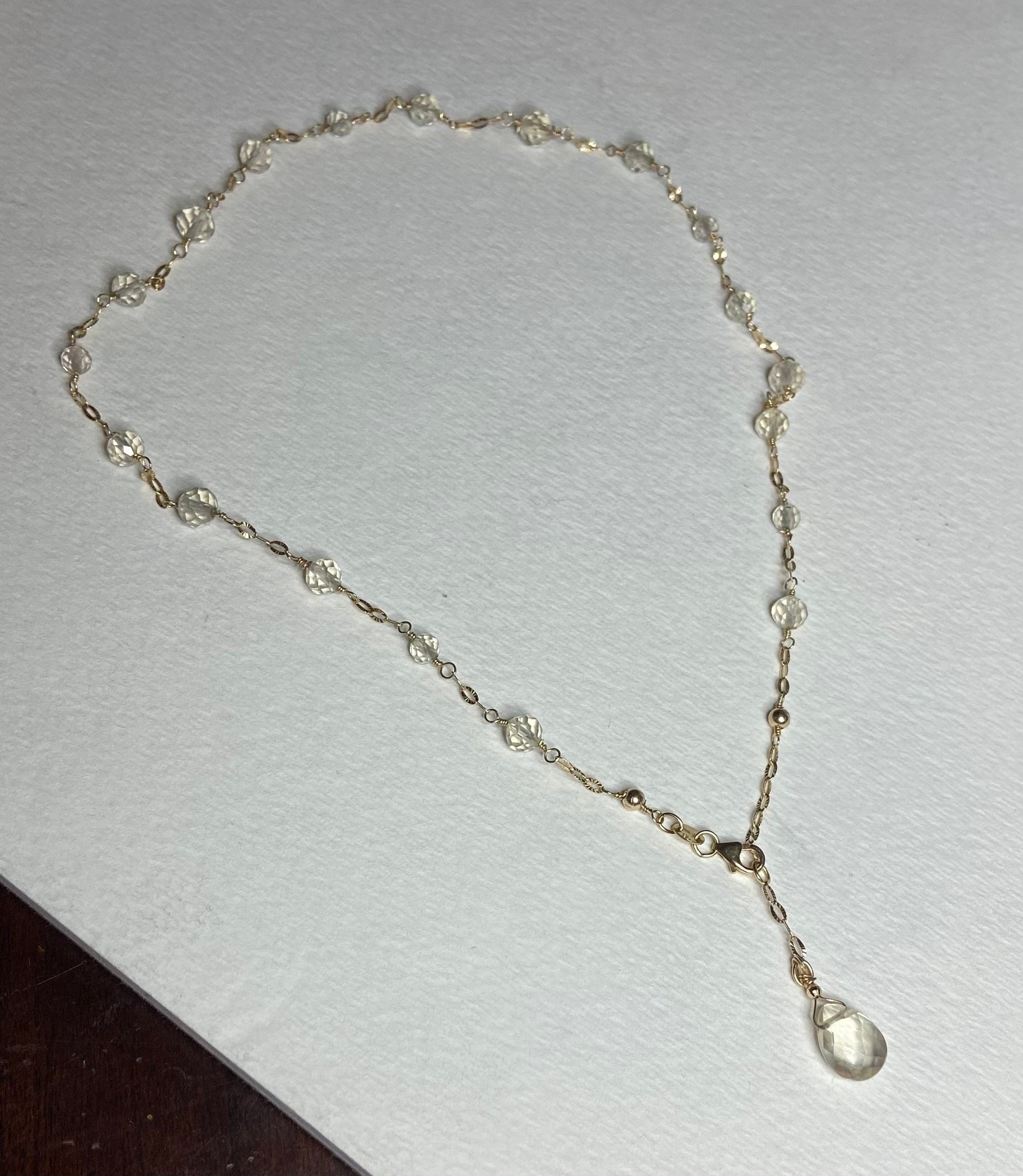 14k yellow gold choker necklace with light yellow Oregon Sunstone beads and a briolette pendant.