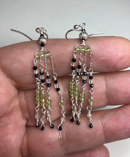 Sterling silver dangle earrings with black diamond and peridot beaded fringe.