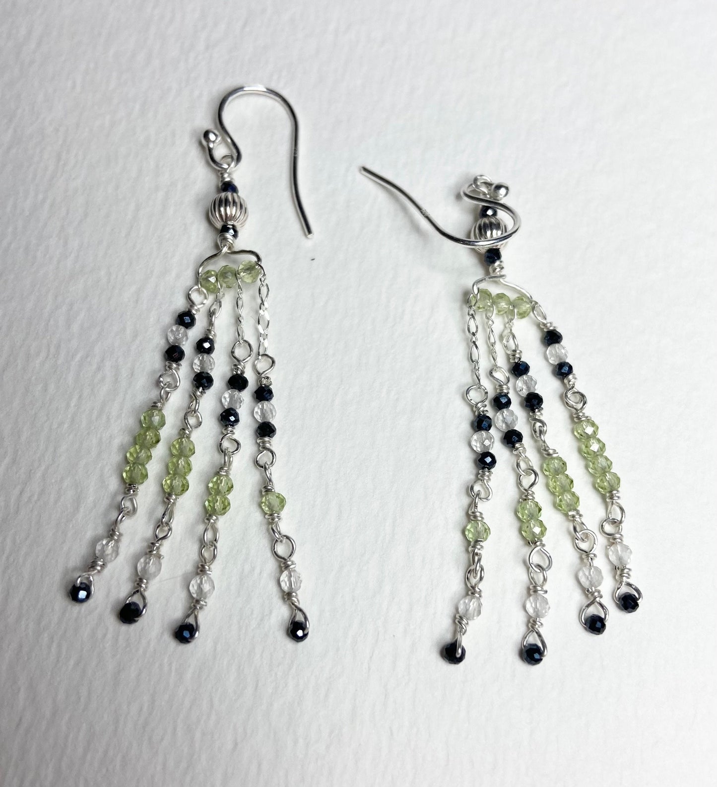 Sterling silver dangle earrings with black diamond, peridot, and quartz beads.
