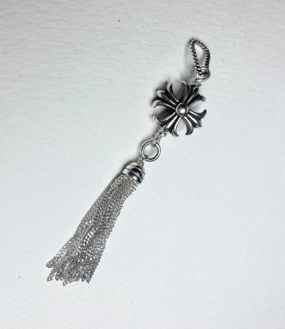 Sterling silver cross tassel pendant with a detailed floral design.