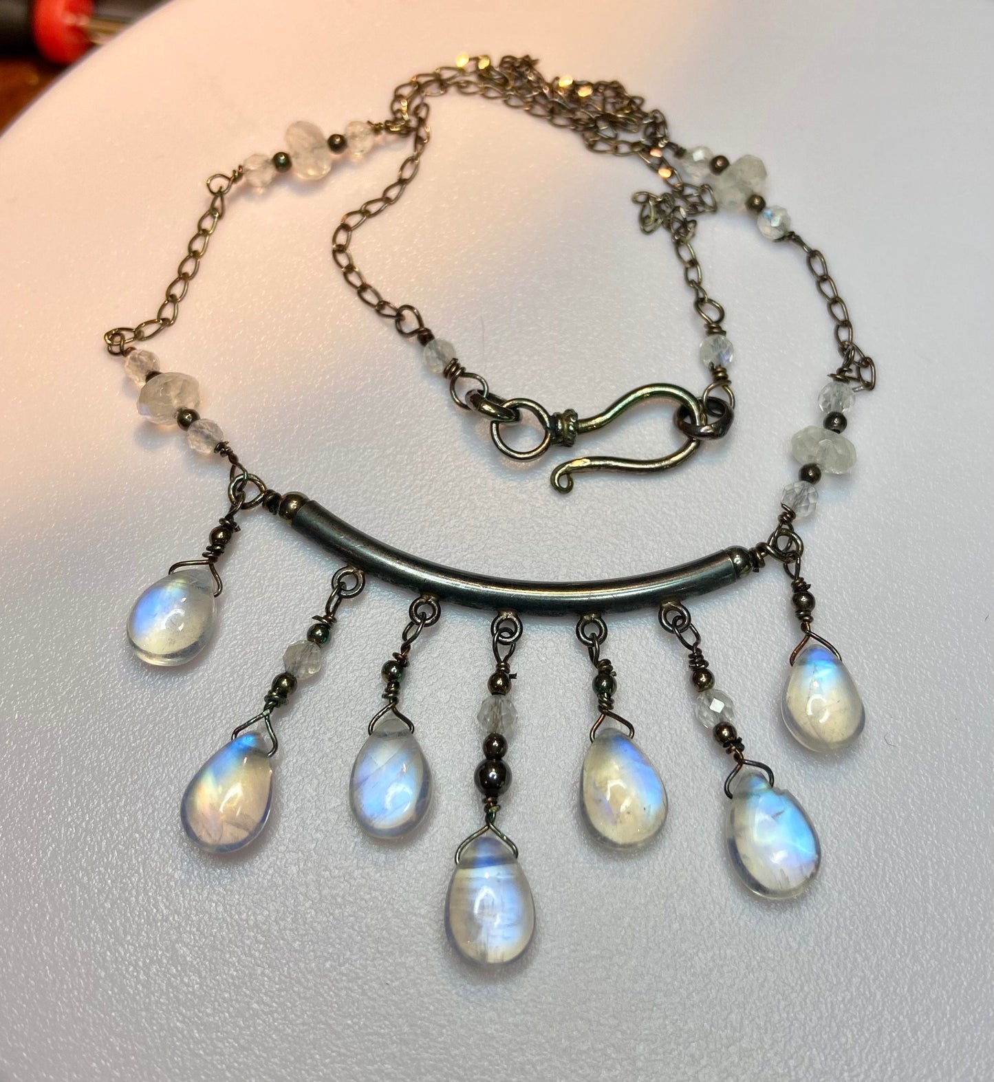 Sterling silver necklace with rainbow blue sheen moonstone teardrop beads and rondelles.