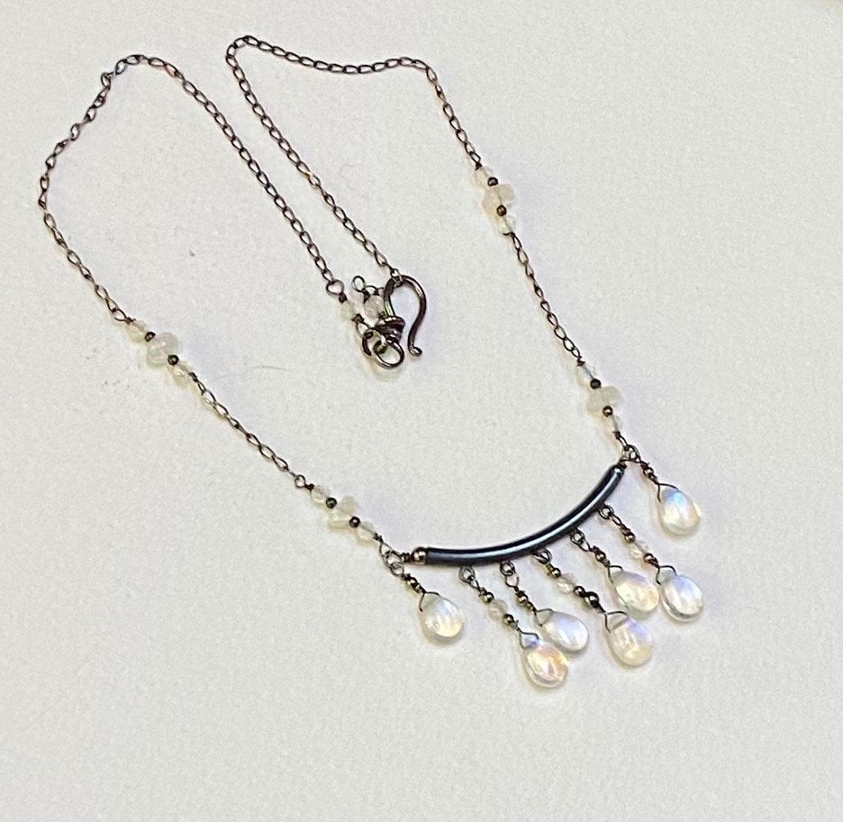 Sterling silver necklace with rainbow moonstone teardrops and rondelles.