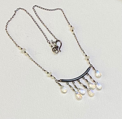 Sterling silver necklace with rainbow moonstone teardrops and rondelles.