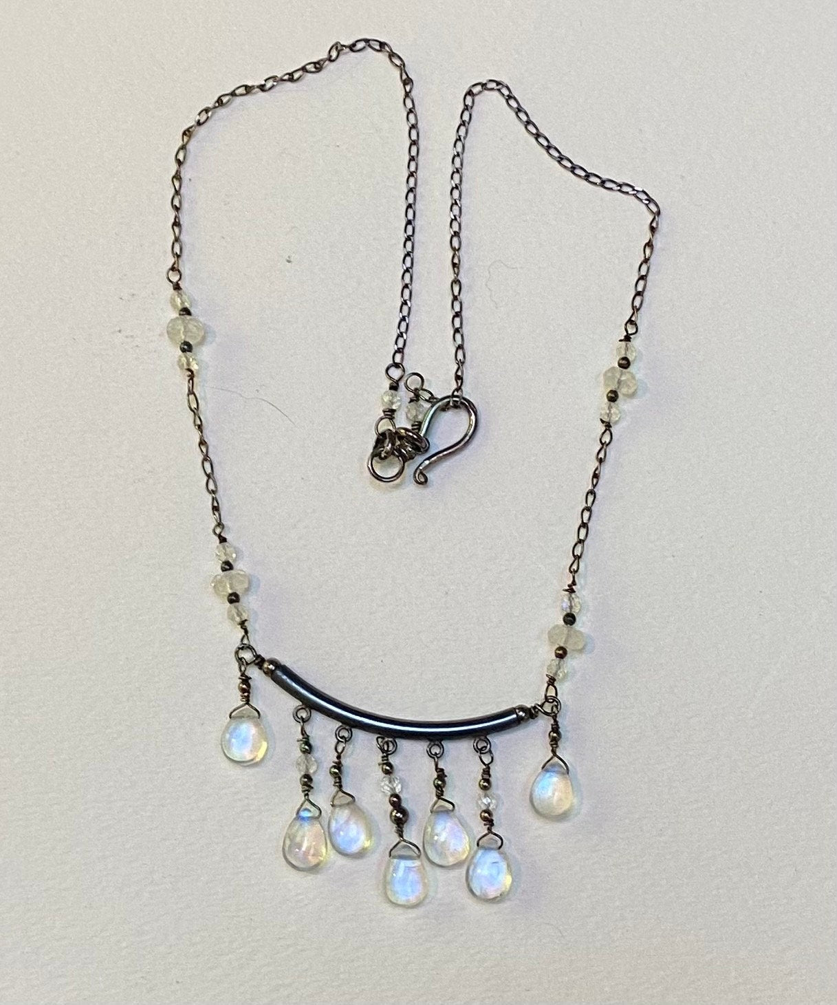 Sterling silver necklace with rainbow moonstone teardrops and rondelles.
