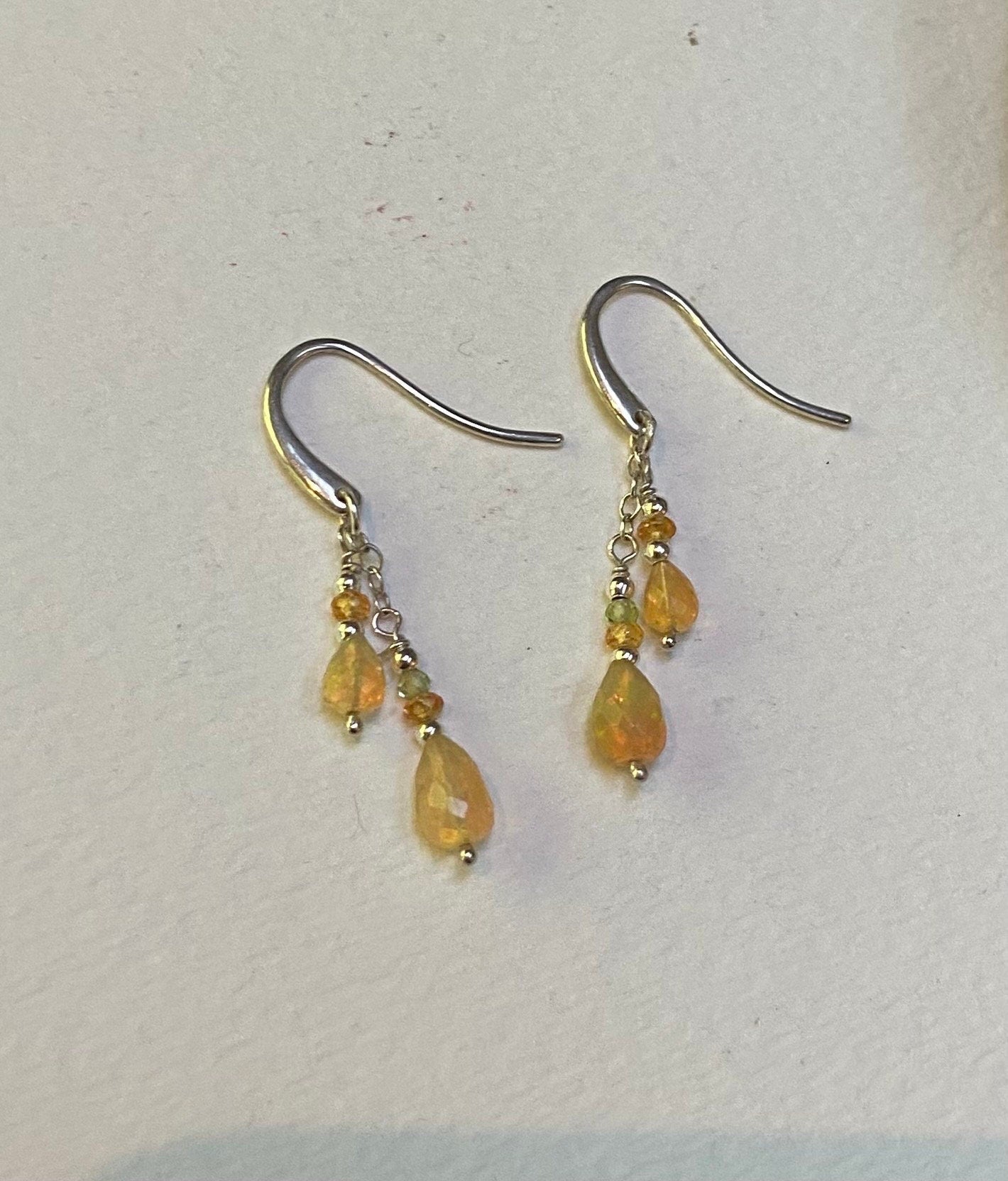 Natural Ethiopian yellow opal dangle drop earrings in sterling silver with peridot and spessartite.