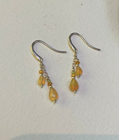 Natural Ethiopian yellow opal dangle drop earrings in sterling silver with peridot and spessartite.