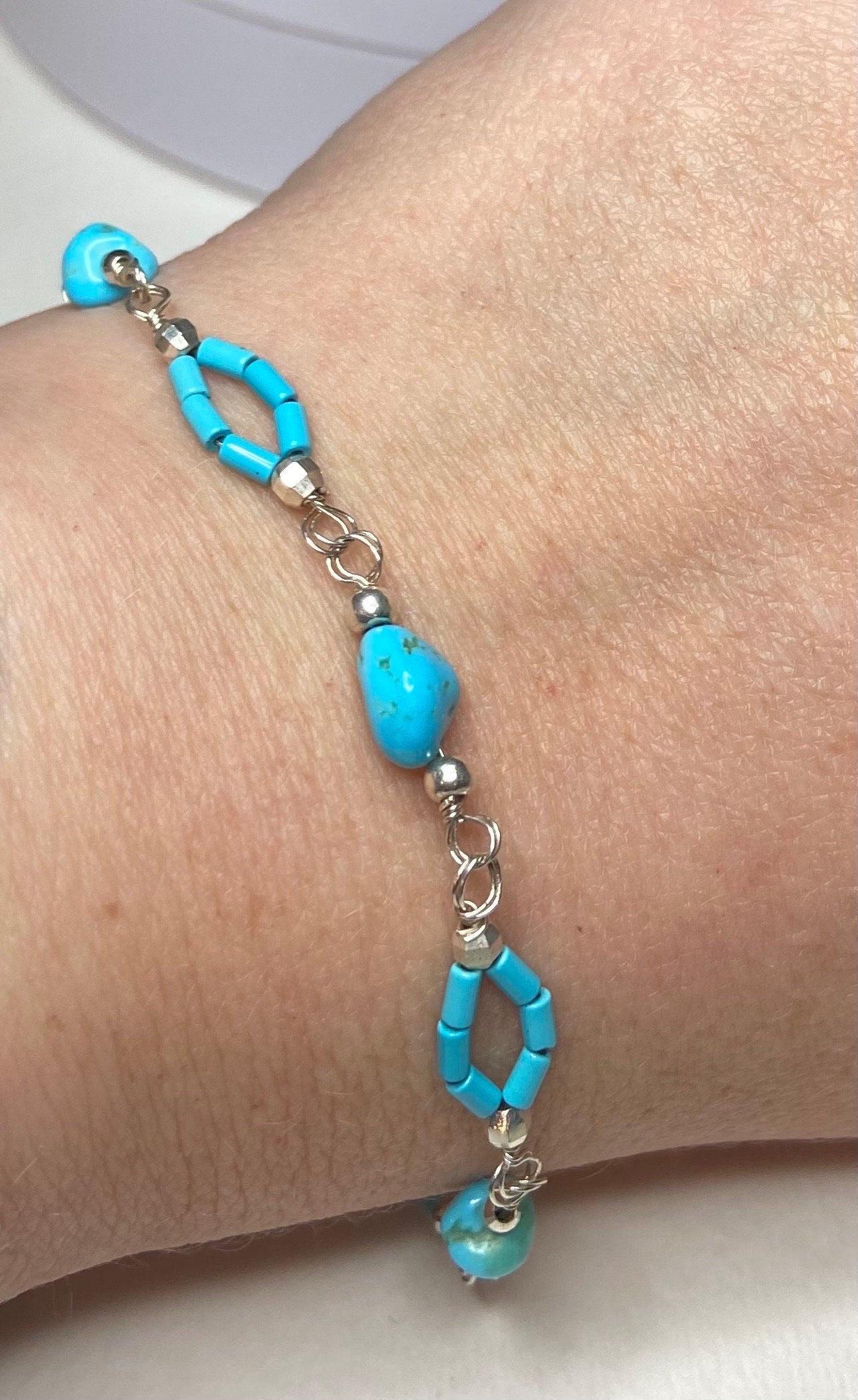 Sterling silver bracelet with Sleeping Beauty turquoise nuggets and beads.