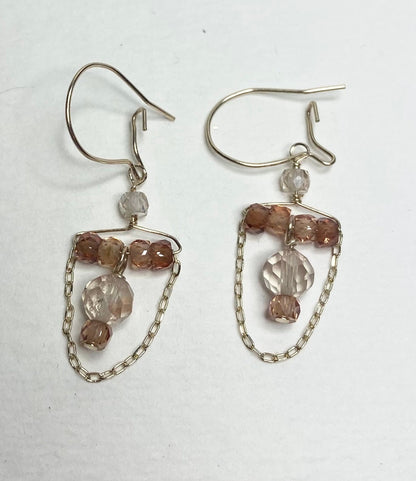14k yellow gold dangle earrings with Oregon sunstones and natural zircons.