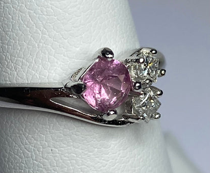 Sterling silver ring with pink tourmaline and two diamonds.