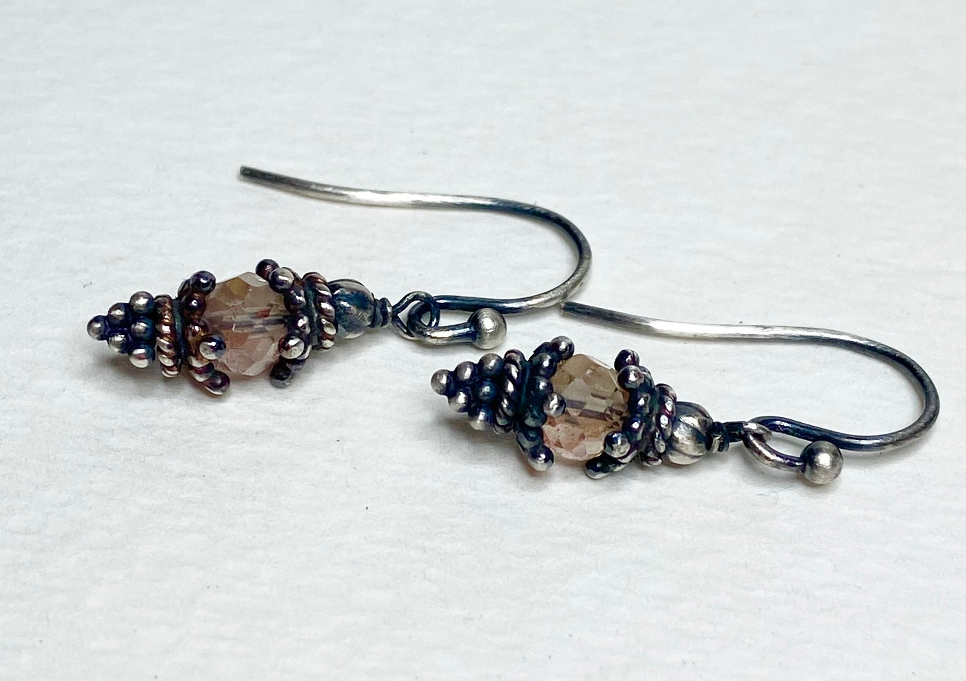 Oregon sunstone dangle drop Bali style earrings in solid sterling silver.