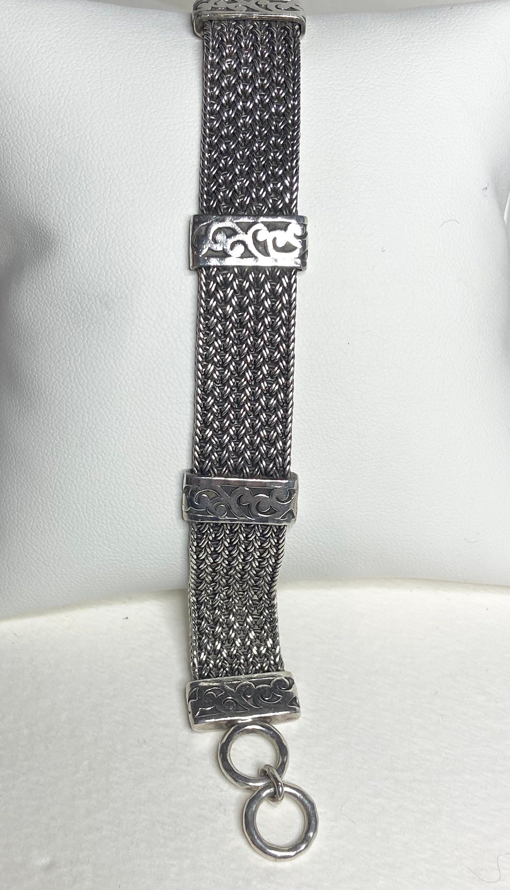 Lois Hill wide woven sterling silver bracelet with toggle closure.
