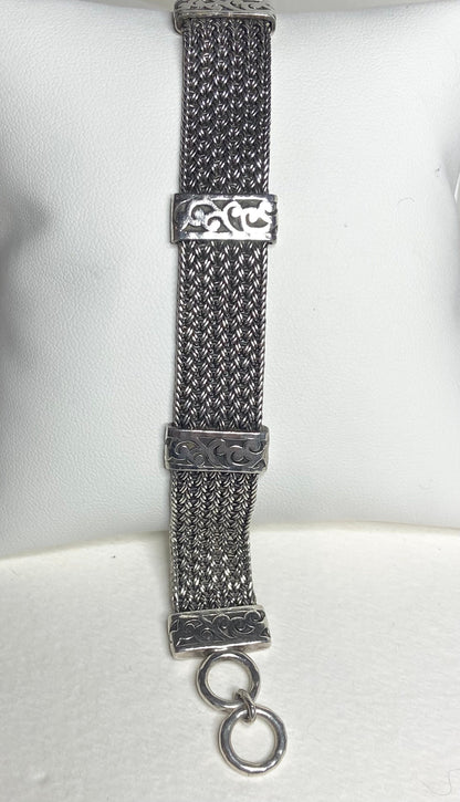 Lois Hill wide woven sterling silver bracelet with toggle closure.