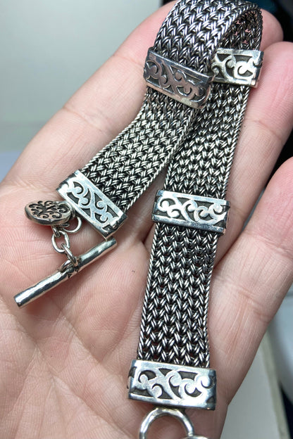 Lois Hill wide woven sterling silver bracelet with toggle clasp.