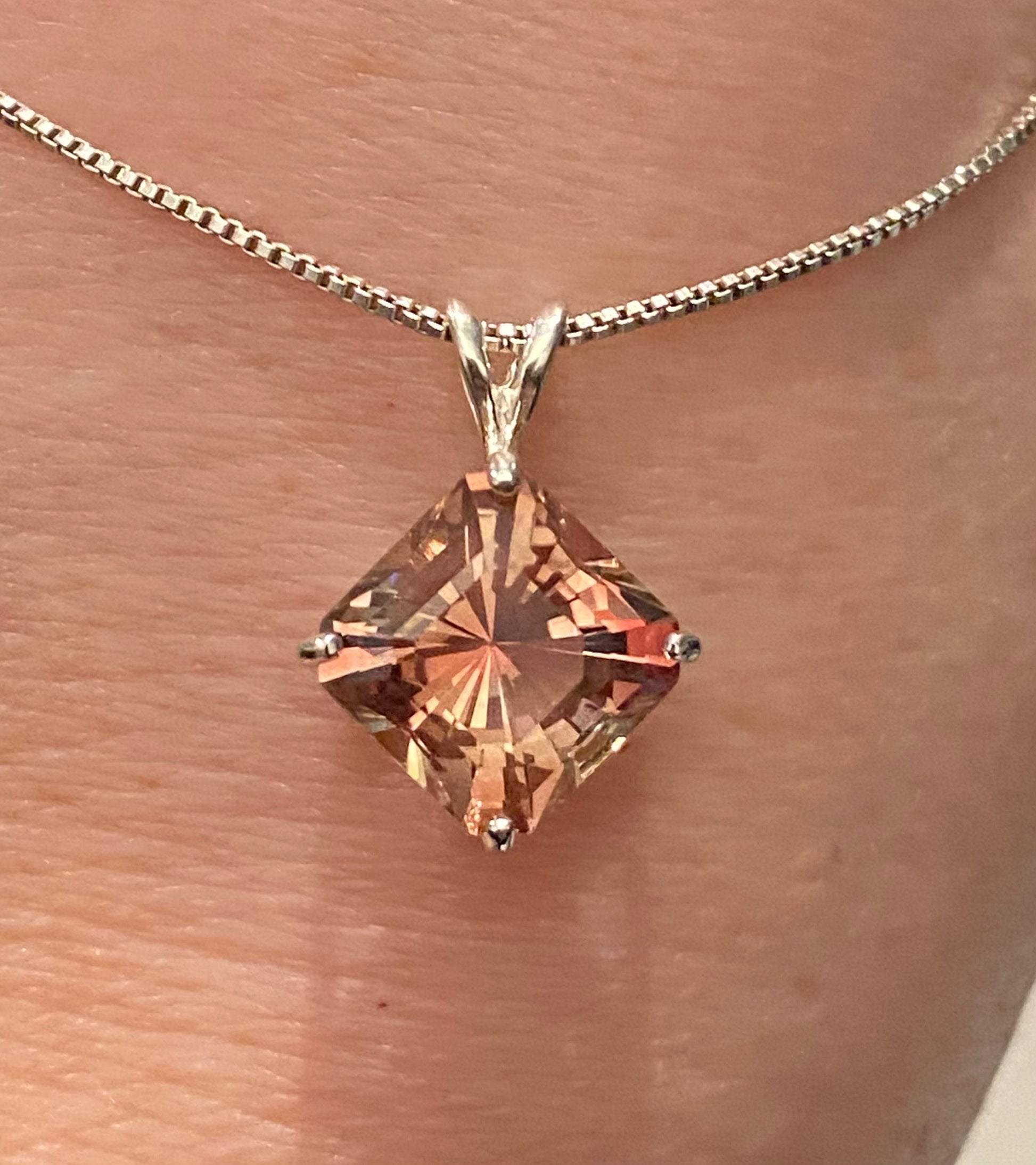 Sterling silver pendant necklace with a large, square-cut Oregon sunstone.