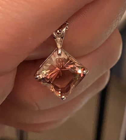 Large Oregon Sunstone pendant in sterling silver with peach and red hues.