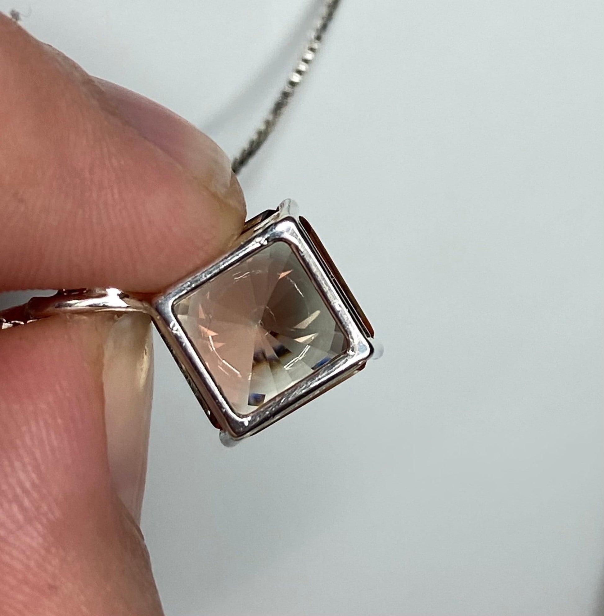 Sterling silver pendant necklace with a large, square-cut Oregon sunstone.