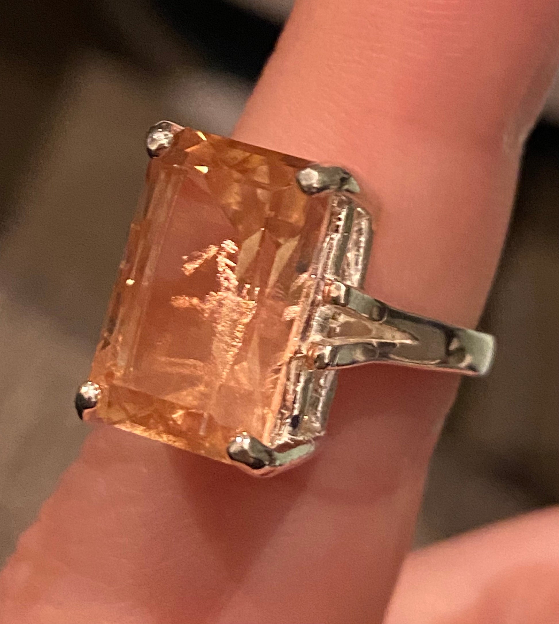 Large emerald cut Oregon sunstone ring in sterling silver.