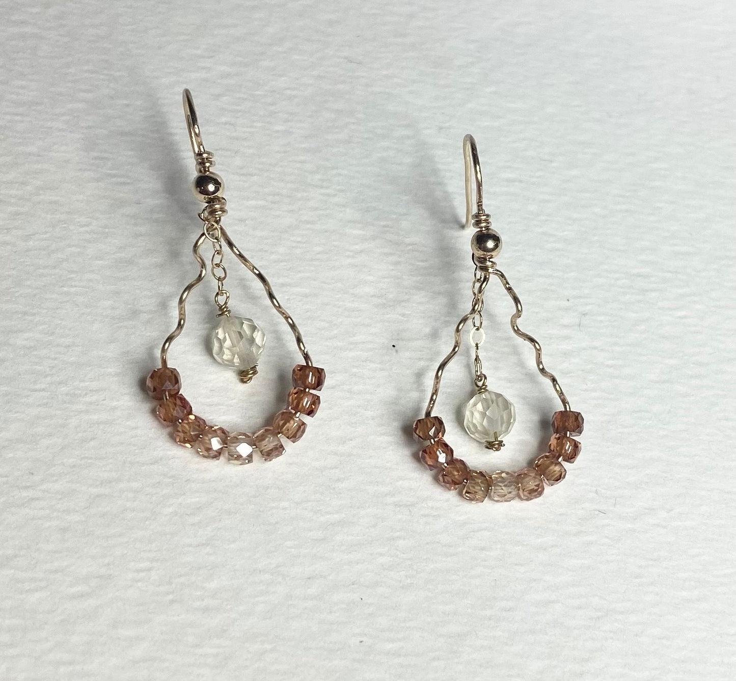 Dangle drop earrings with brown zircons and a faceted Oregon sunstone.