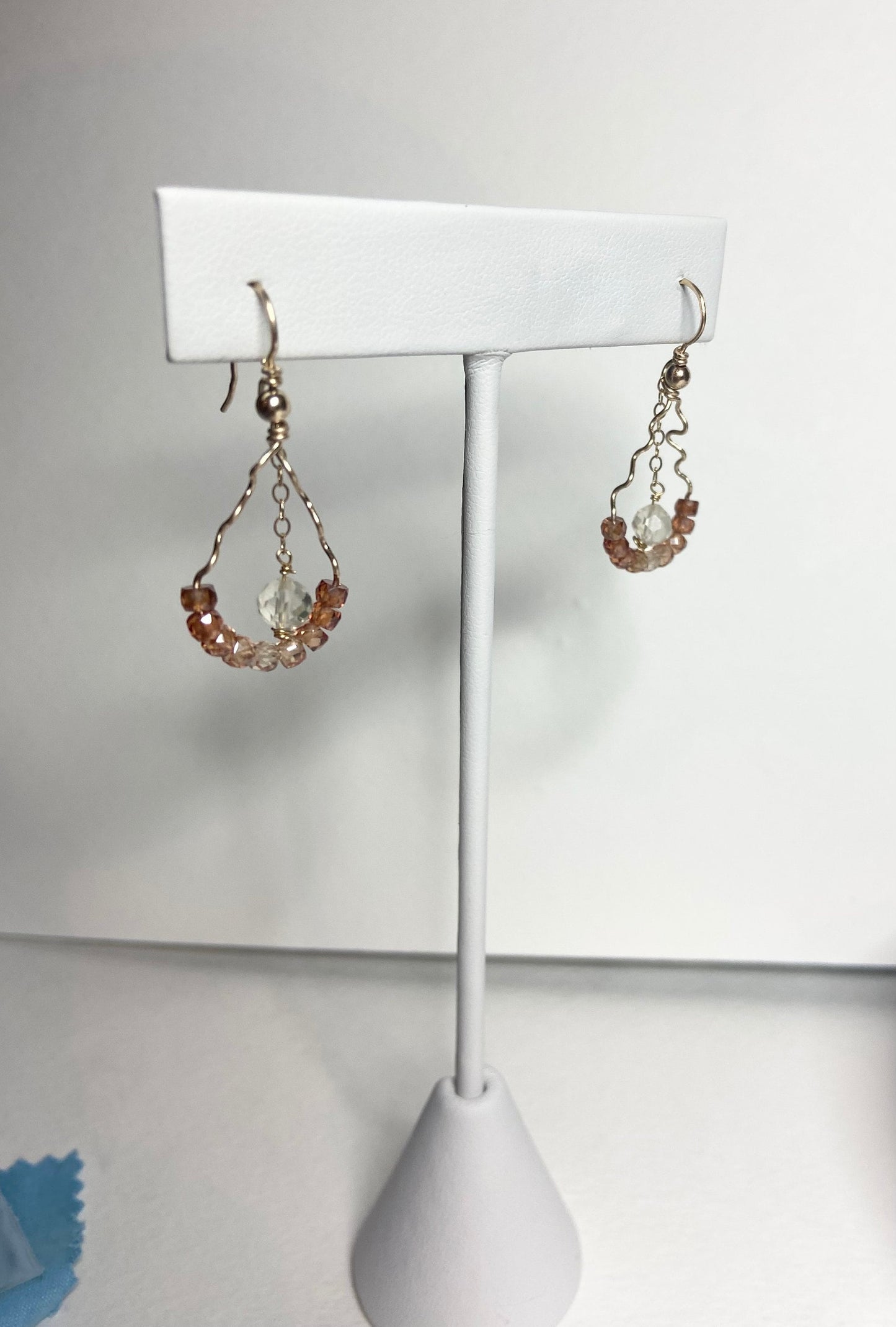 Hand-forged dangle earrings with natural zircons and an Oregon sunstone.