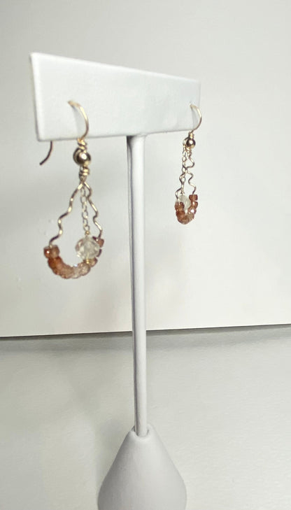 Hand-forged dangle earrings with natural zircons and an Oregon sunstone.