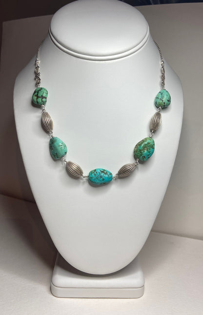 Turquoise and silver beaded choker necklace.