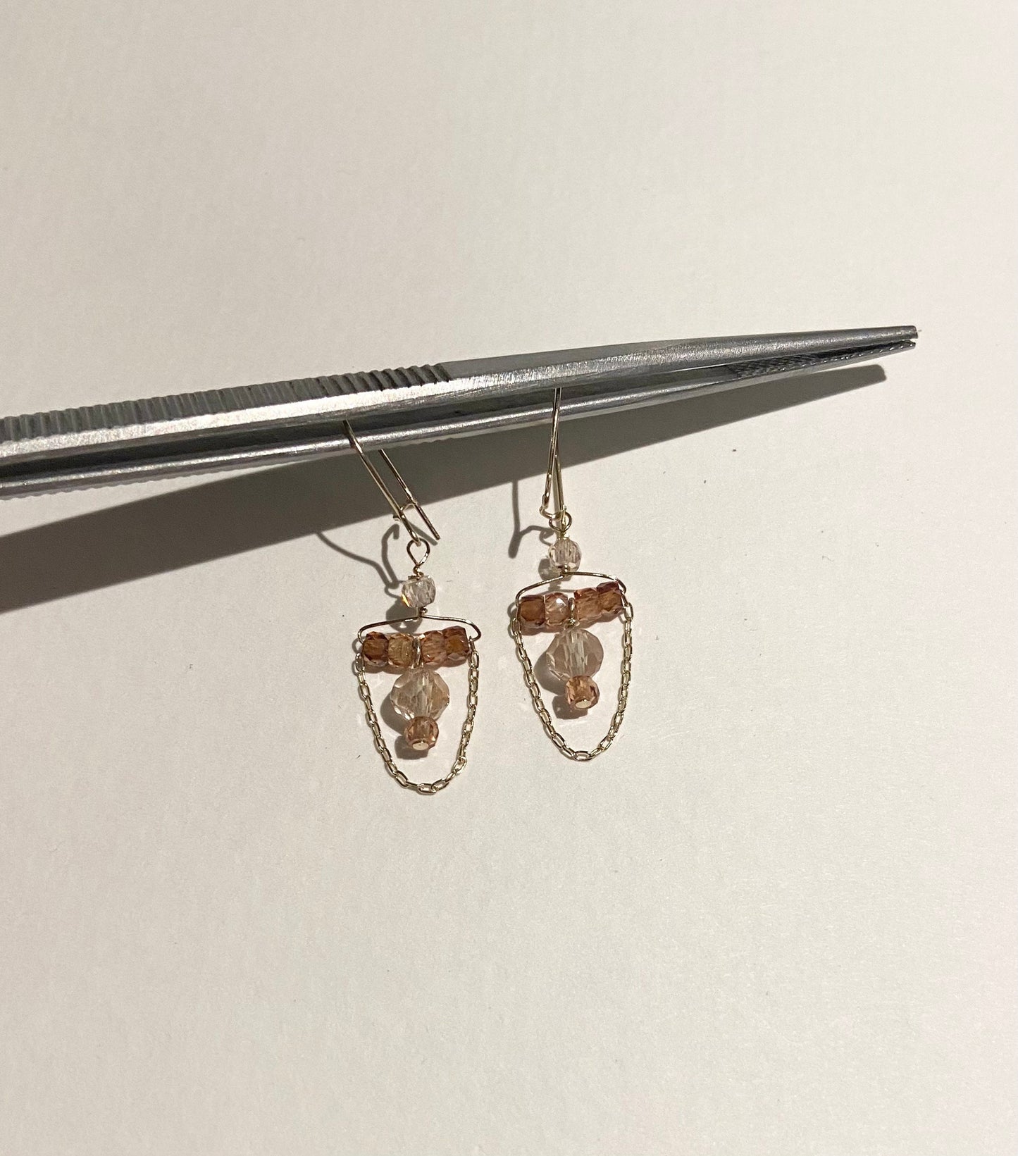 14k gold dangle earrings with Oregon sunstones and natural zircons.