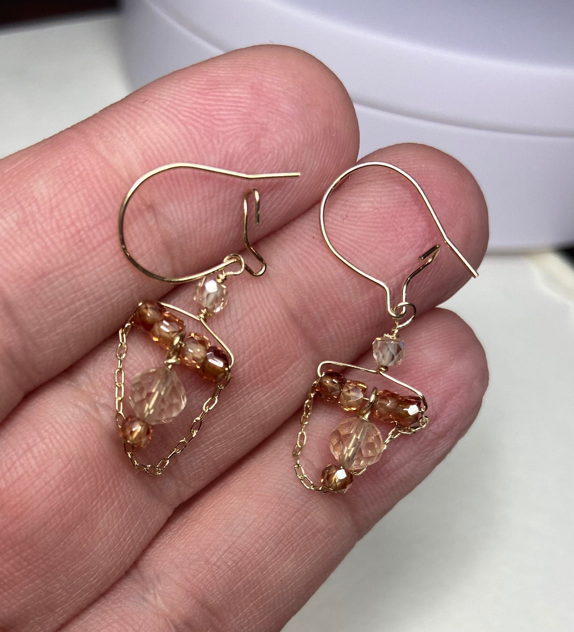 Solid 14k gold dangle earrings with Oregon Sunstone and natural zircons.