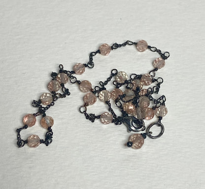 Adjustable sterling silver necklace with peach Oregon sunstone beads.