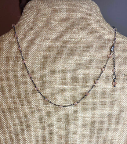 Oregon sunstone beaded sterling silver station necklace on burlap.