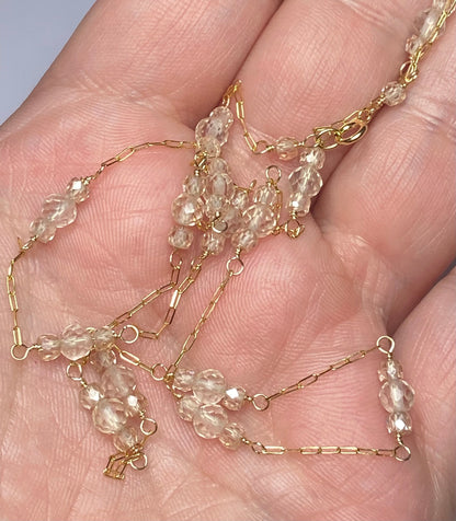 Solid 14k yellow gold necklace with faceted Oregon sunstones and natural zircons.