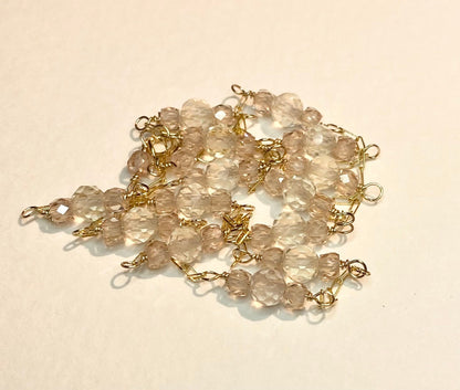 A delicate 14k yellow gold necklace with faceted Oregon sunstones and natural zircons.