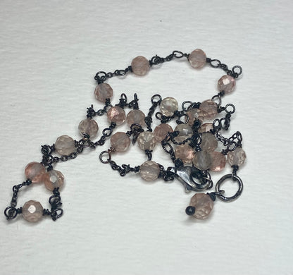 Adjustable sterling silver necklace with peach Oregon sunstone beads.