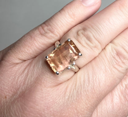 Sterling silver band ring with a large, emerald-cut Oregon sunstone.