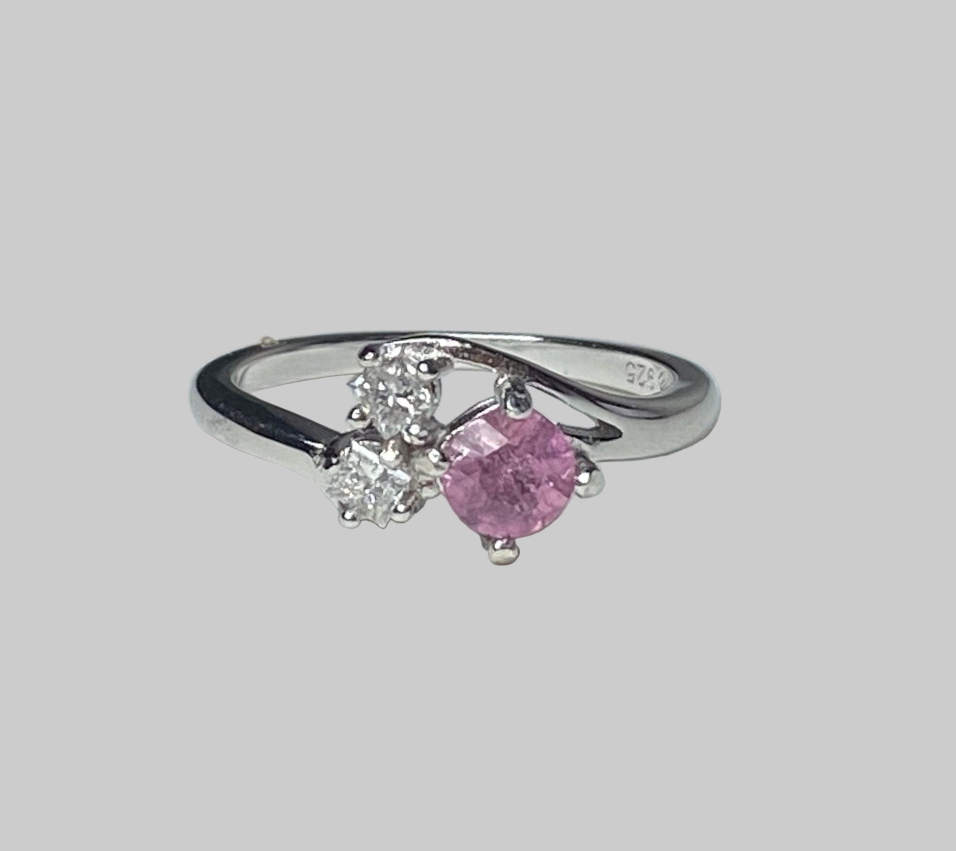 Sterling silver ring with pink tourmaline and two diamonds.