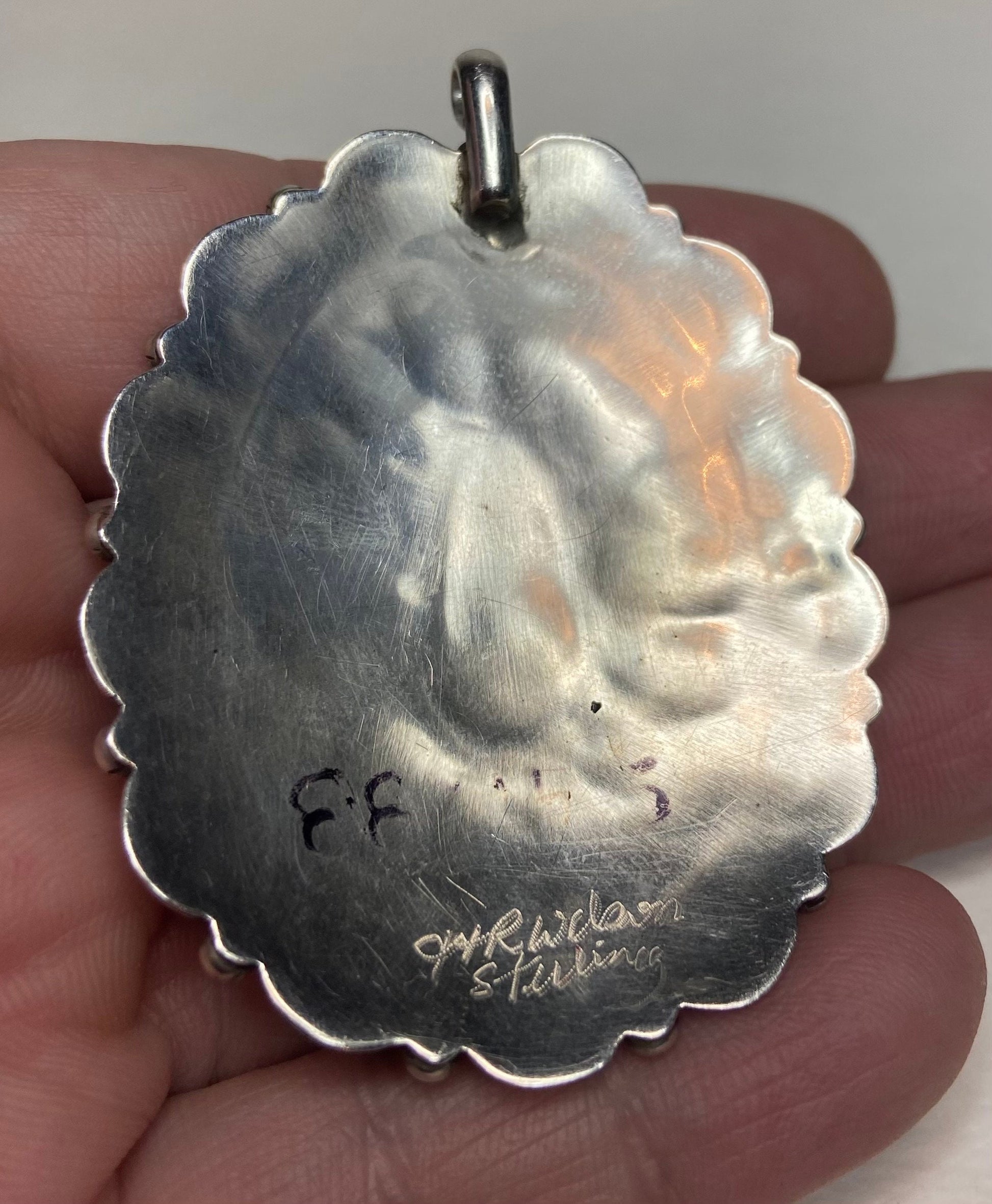 Southwest sterling silver pendant with turquoise, signed on back.