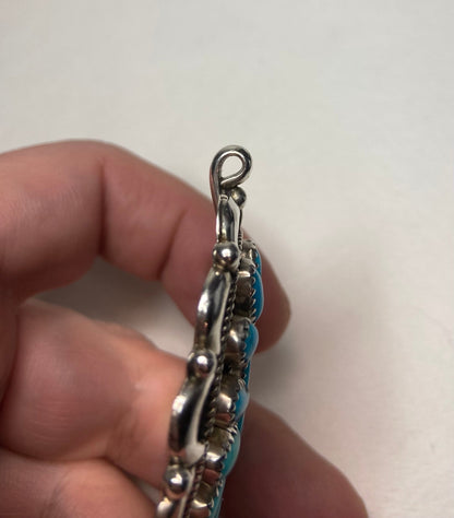Southwest turquoise and sterling silver pendant with bale.