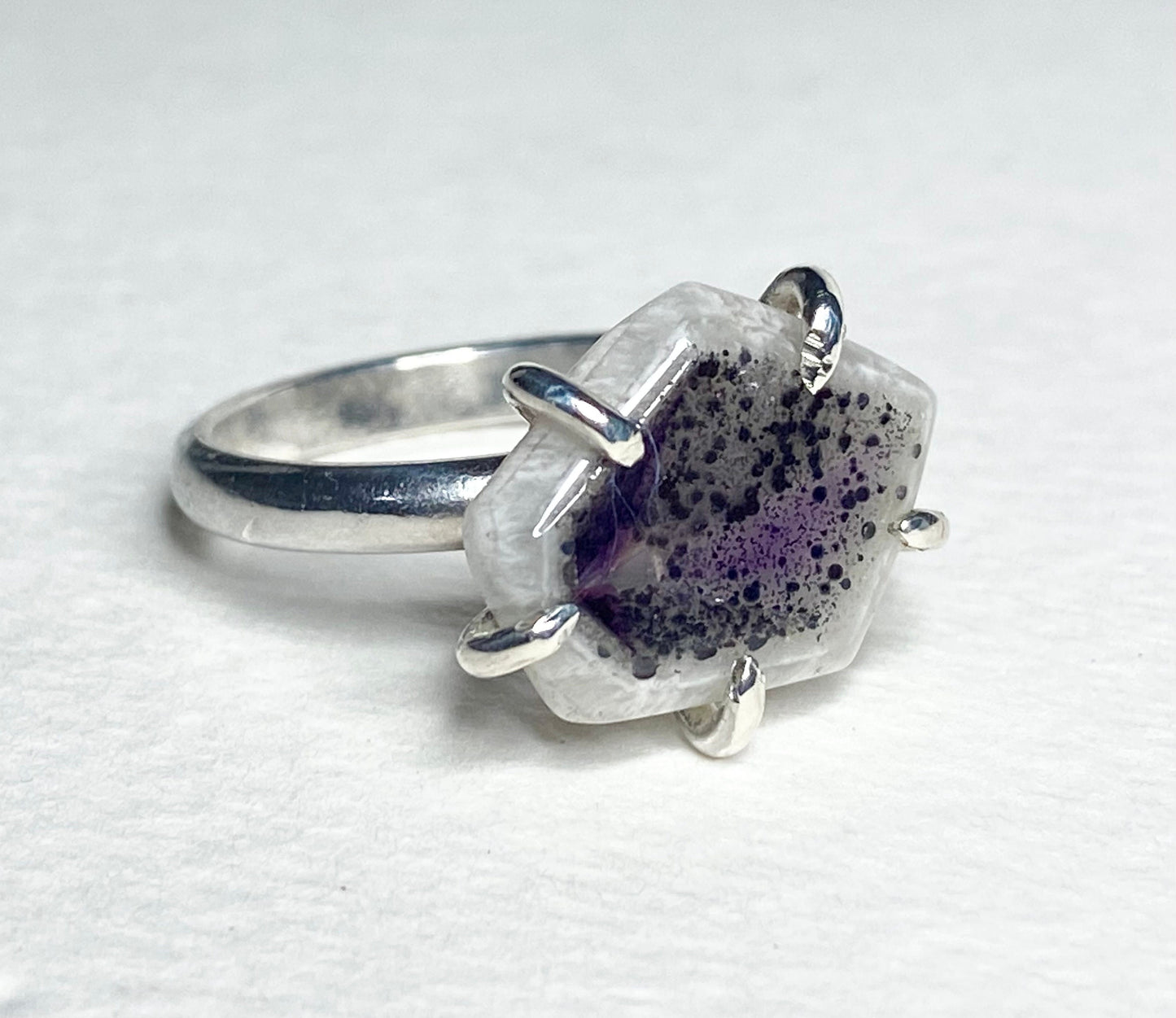 Sterling silver ring with a freeform quartz stone featuring amethyst inclusions, size 8.