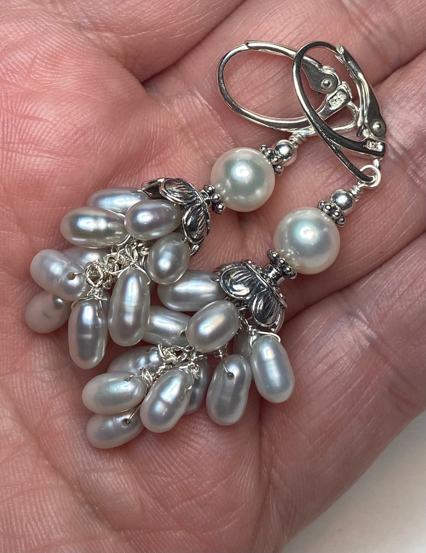 Multi silver and white freshwater pearl sterling silver dangle drop earrings with lever backs.