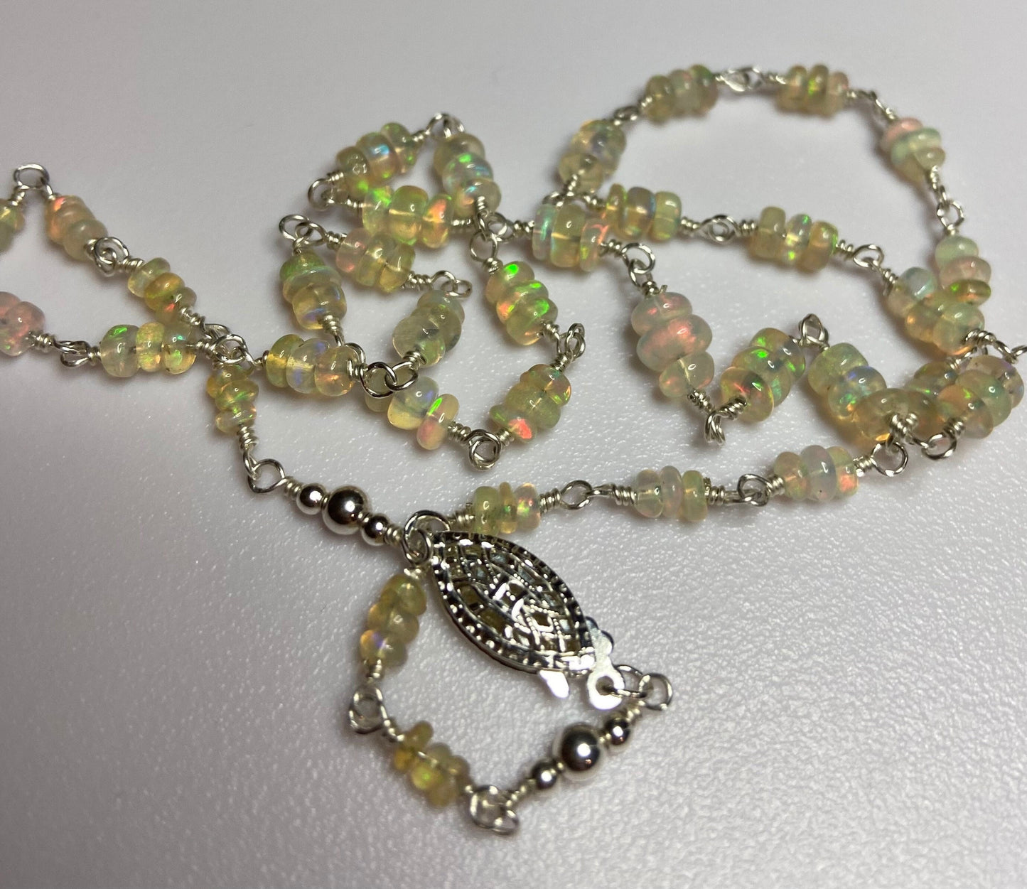 Ethiopian Wello Opal beaded necklace in solid sterling silver with a filigree clasp.