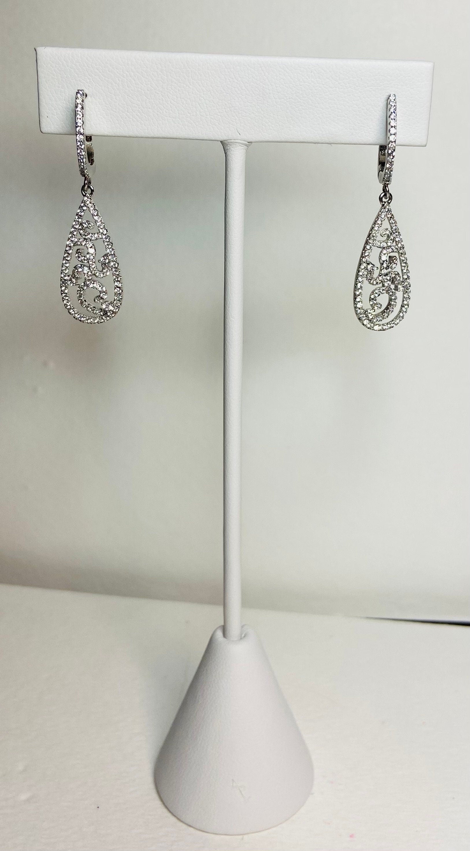 Sterling silver pave tear drop dangle earrings with lever backs.