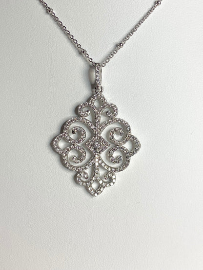 Rhodium over sterling silver pave swirl pendant necklace.