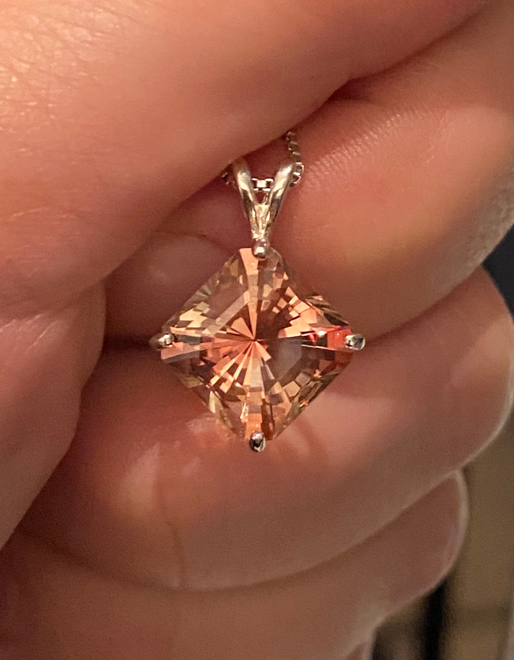 Sterling silver pendant necklace with a large, square-cut Oregon sunstone.
