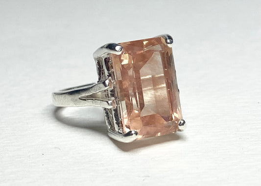 Sterling silver band ring with a large, emerald-cut Oregon sunstone.