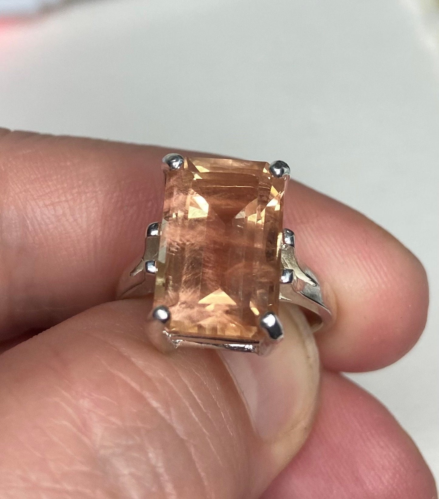 Large Oregon Sunstone emerald cut band ring in sterling silver.