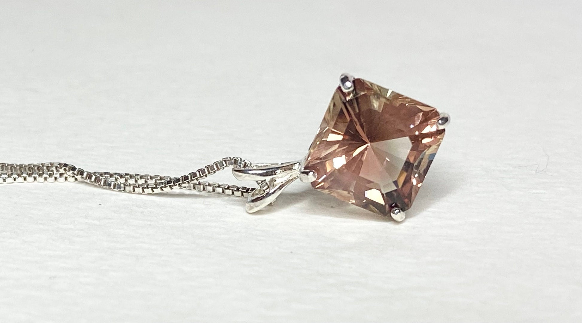 Sterling silver pendant necklace with a large, square-cut Oregon sunstone.