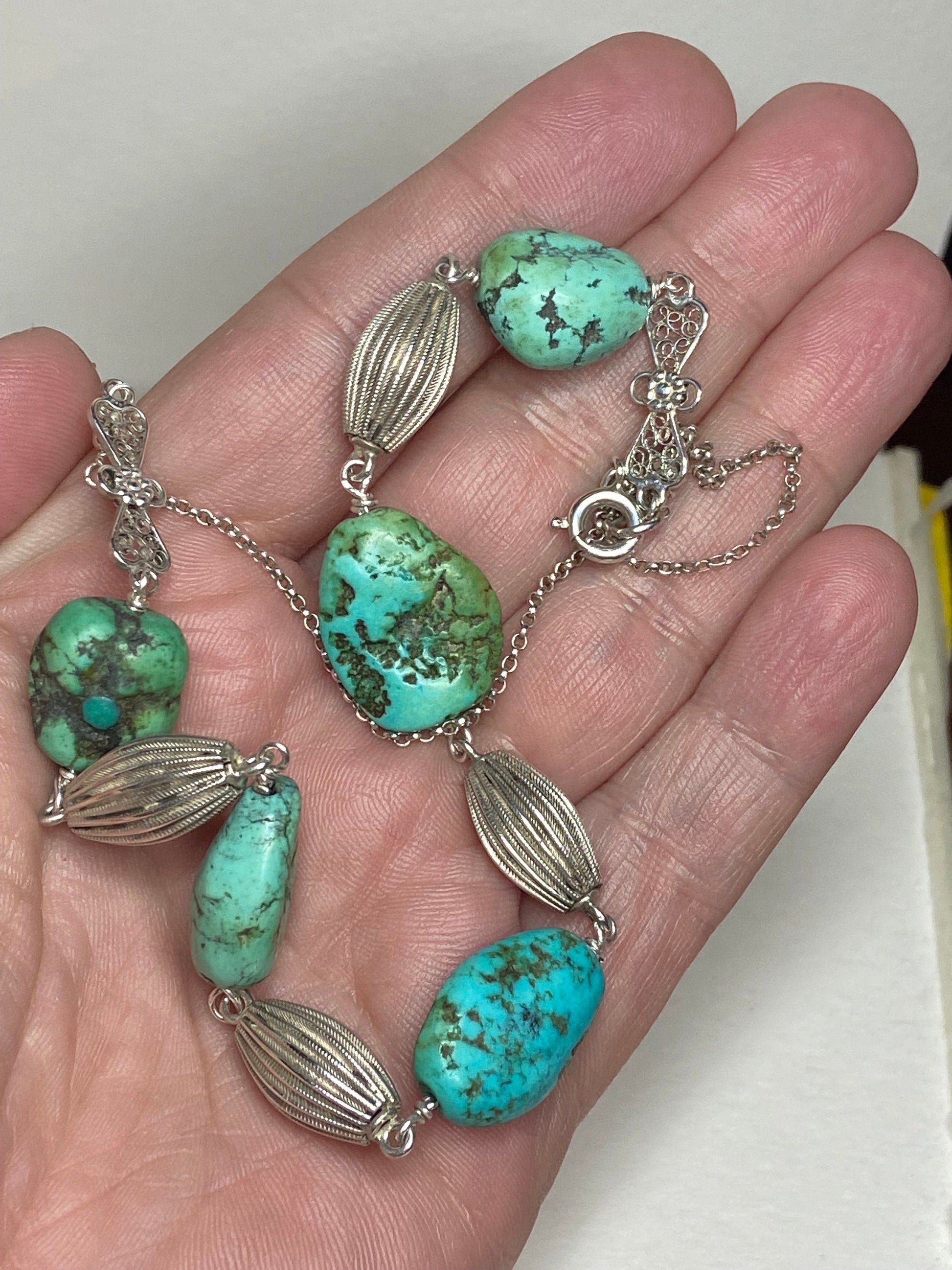 Vintage turquoise beaded necklace with silver accents.